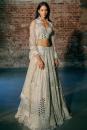 Swirl hand emb tulle blouse paird with hand emb lehenga and tulle dupatta