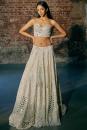 Swirl hand emb tulle blouse paird with hand emb lehenga and tulle dupatta