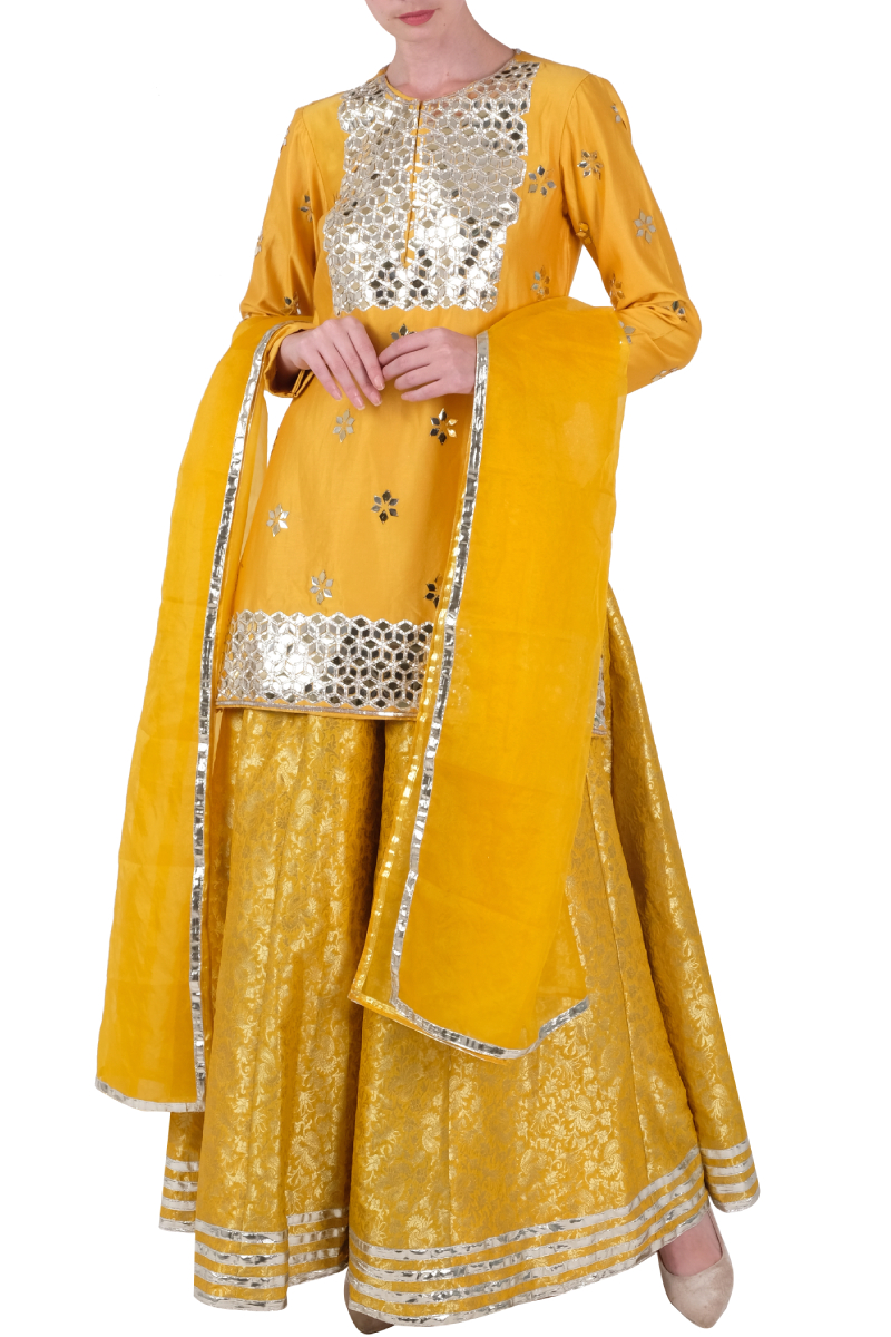 Yellow sharara set Design by Neha Khullar at Modvey